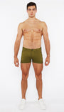 Man wearing green underwear on a white background