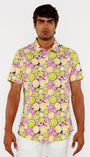 Man wearing a colorful patterned shirt with a white background