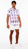 Man wearing a floral shirt and white shorts on a white background