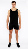 Man wearing a black tank top and shorts on a white background