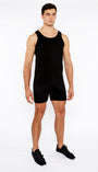 Man wearing a black tank top and shorts on a white background