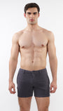 A pair of charcoal gray, slim-fit chino shorts with a 5-inch inseam, zip pockets, and a signature curved stretch waistband.