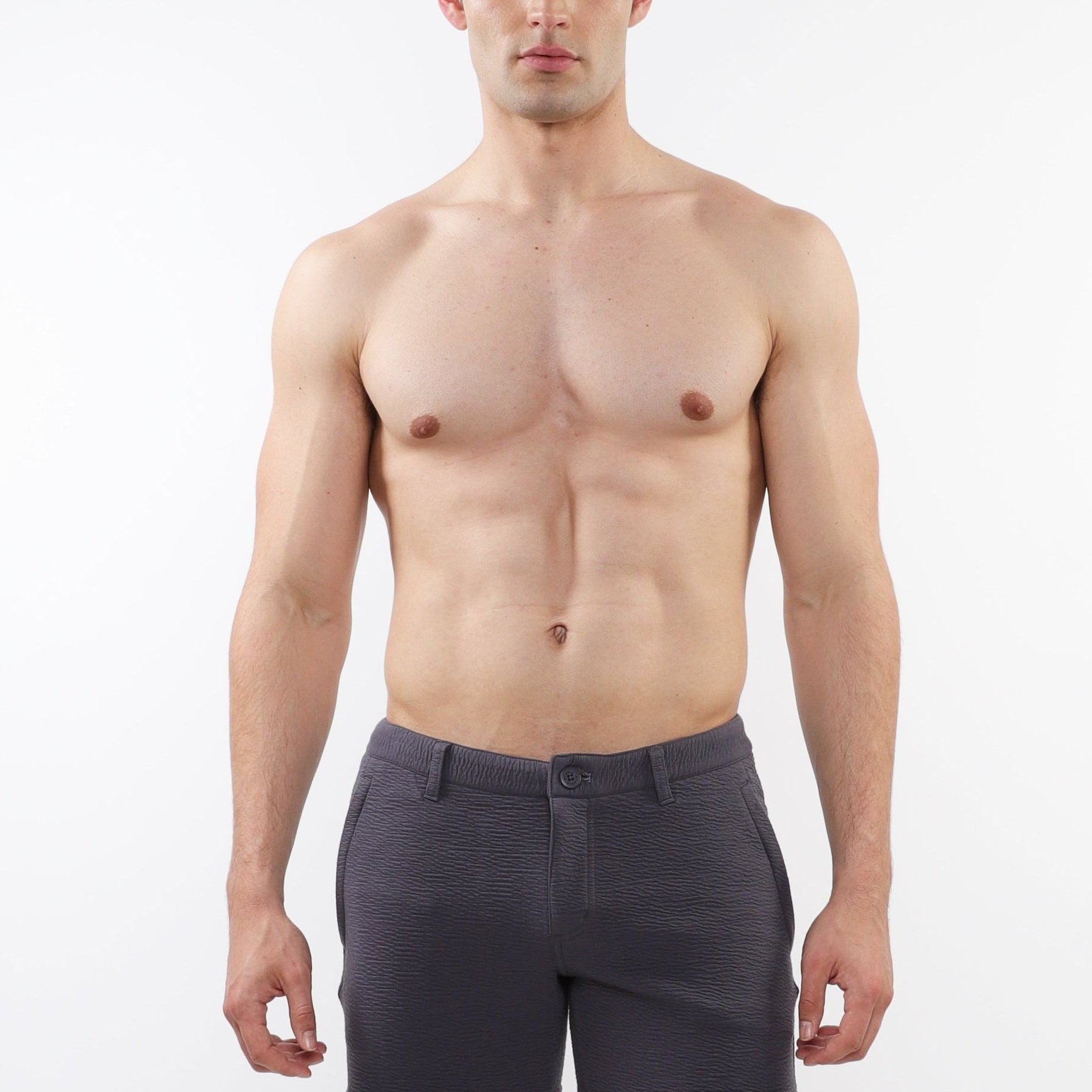 A pair of charcoal gray, slim-fit chino shorts with a 5-inch inseam, zip pockets, and a signature curved stretch waistband.