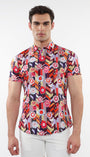 A male model wearing a short-sleeved abstract printed cotton jersey shirt with a contrast placket detail.