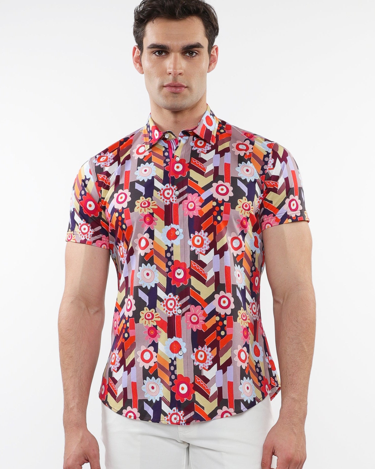 A male model wearing a short-sleeved abstract printed cotton jersey shirt with a contrast placket detail.