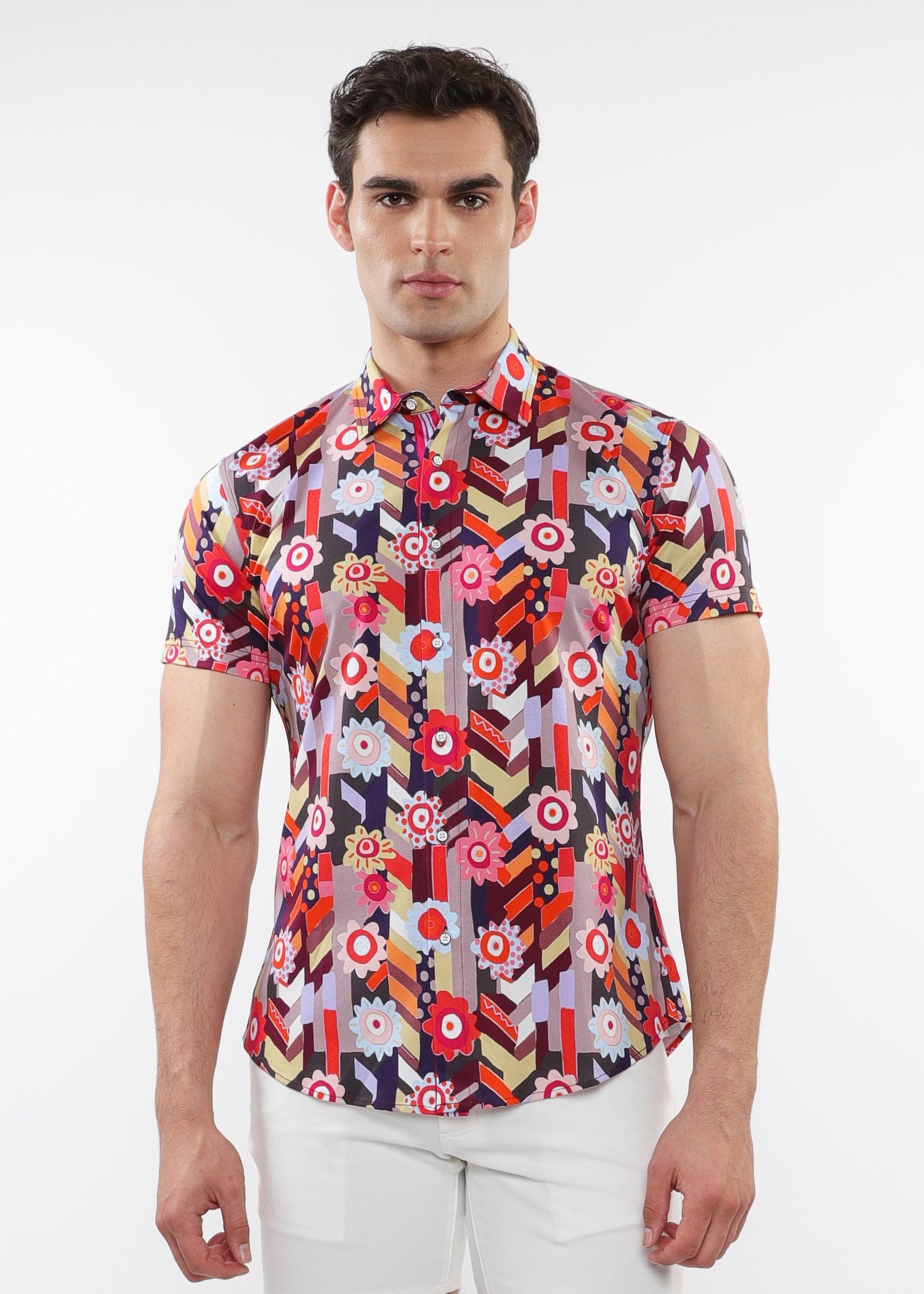 A male model wearing a short-sleeved abstract printed cotton jersey shirt with a contrast placket detail.