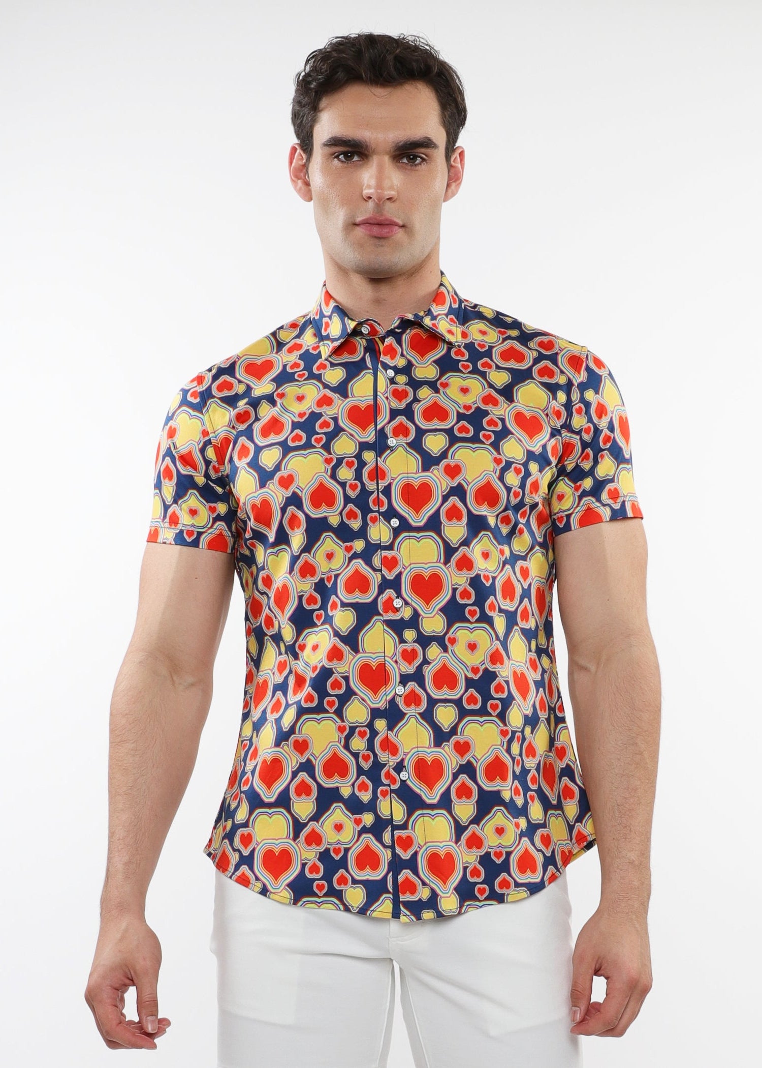 A male model wearing a short-sleeved printed cotton knit jersey shirt with a sapphire blue and persimmon hearts pattern and a contrast placket detail.