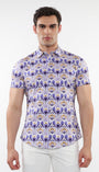 A male model wearing a short sleeve purple and gold floral printed cotton knit jersey shirt with a contrast placket detail and a spread collar.