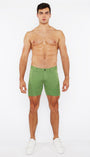 Man wearing green shorts on a white background