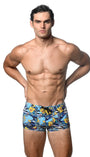 This image features a model wearing navy/yellow floral printed swim trunks, style ST-8016-24. The swim trunks are adorned with a vibrant and playful floral pattern on a blue background, contributing to a stylish and eye-catching look.