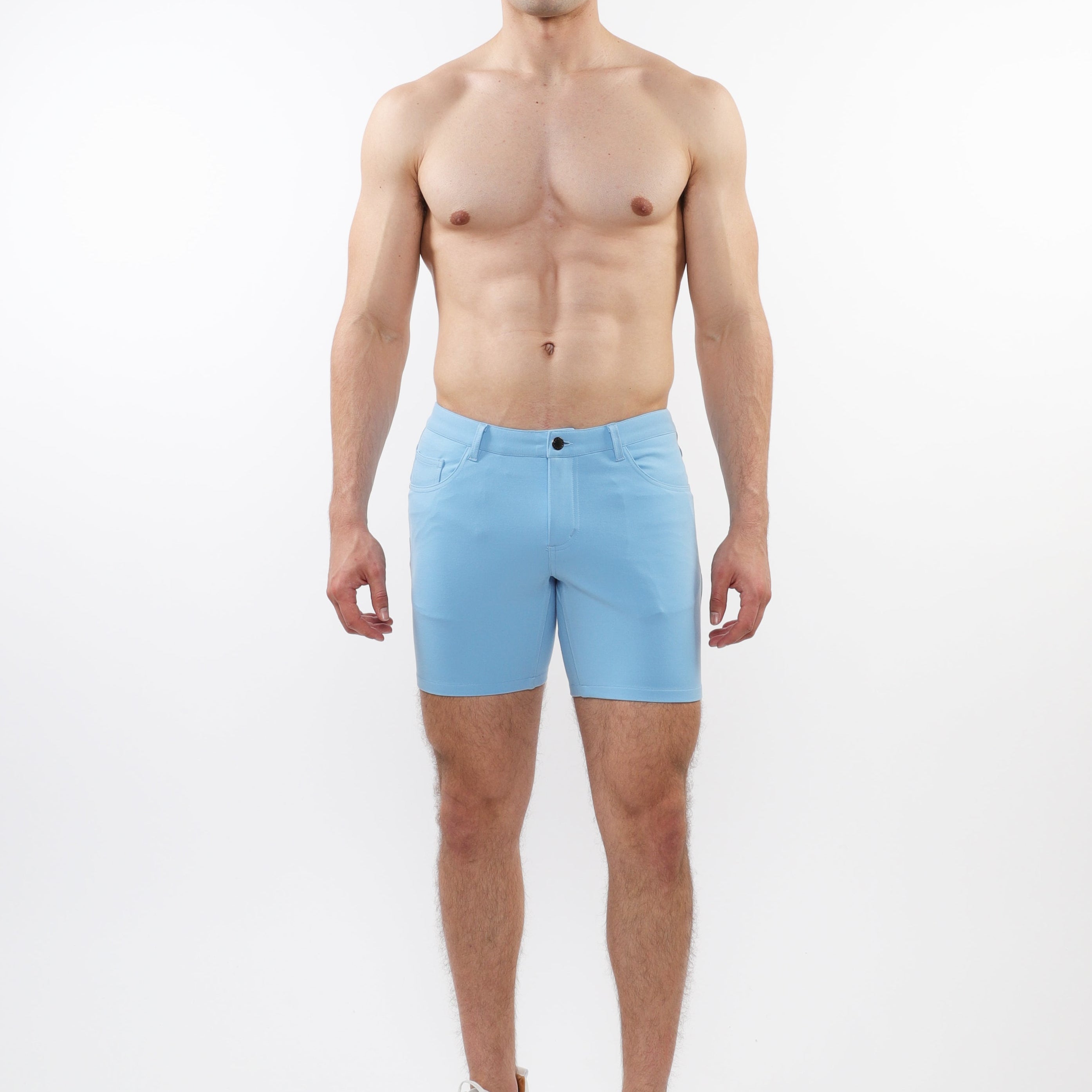 ST33LE mens pale blue stretch shorts worn by shirtless male model with white sneakers