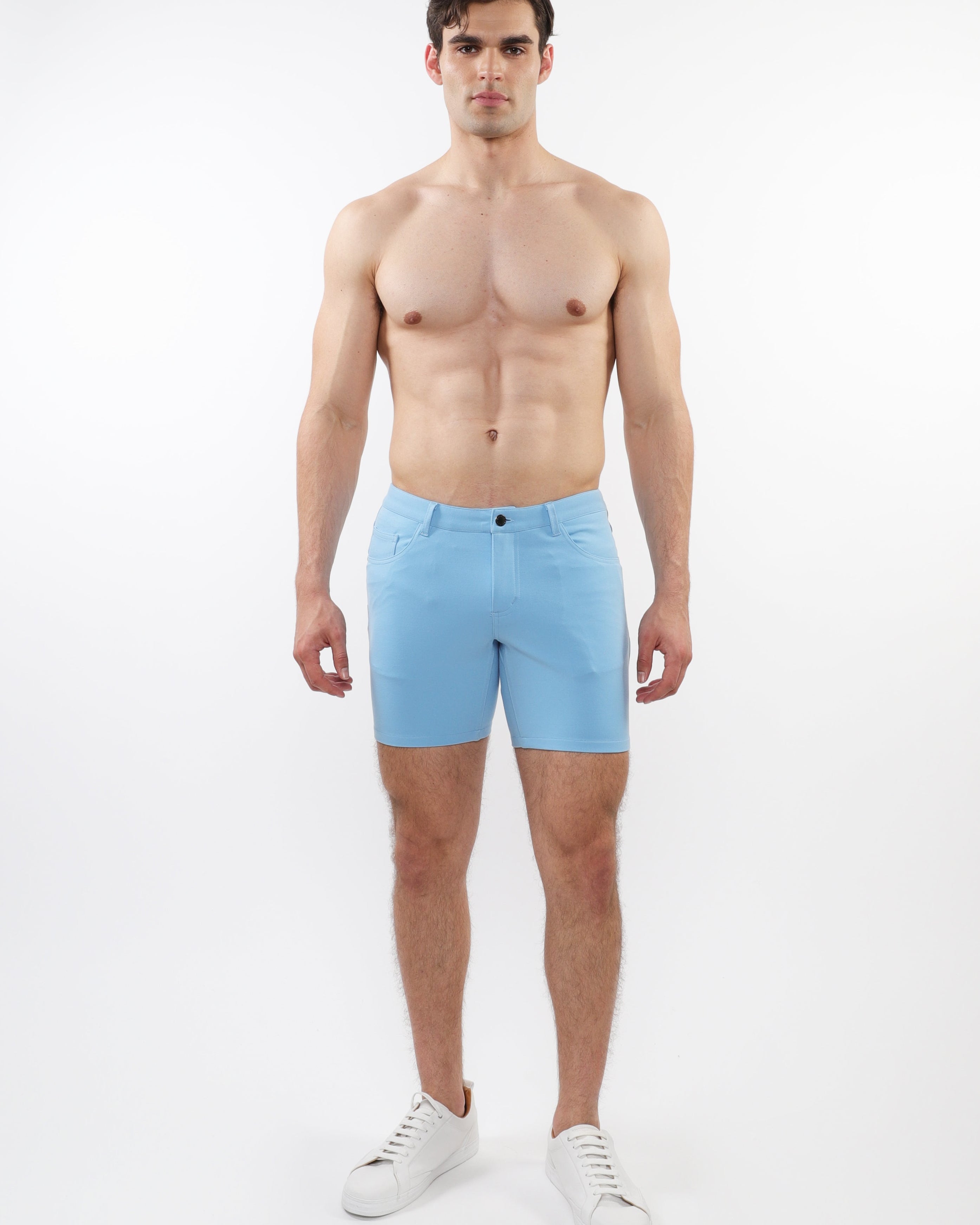 ST33LE mens pale blue stretch shorts worn by shirtless male model with white sneakers