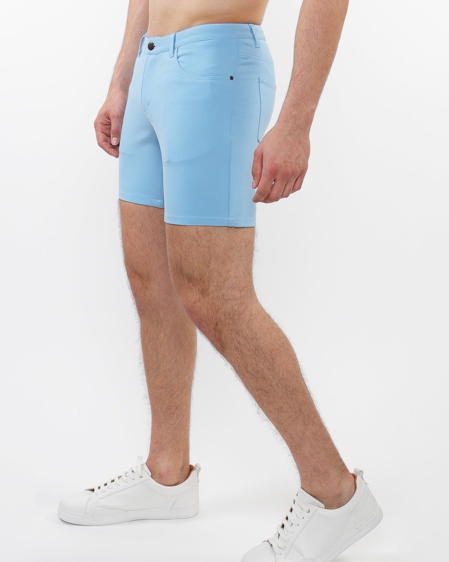 ST33LE mens pale blue stretch shorts worn by male model with white sneakers