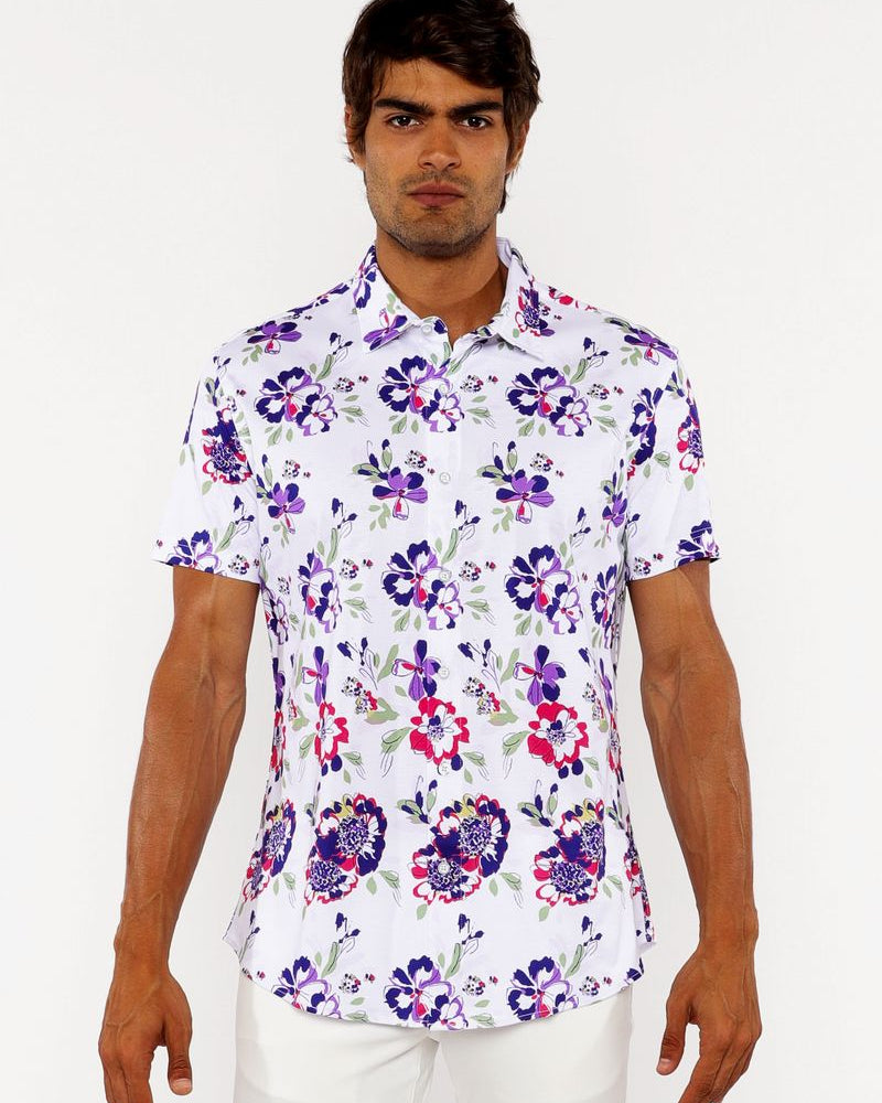 Man wearing a floral short-sleeve shirt on a white background