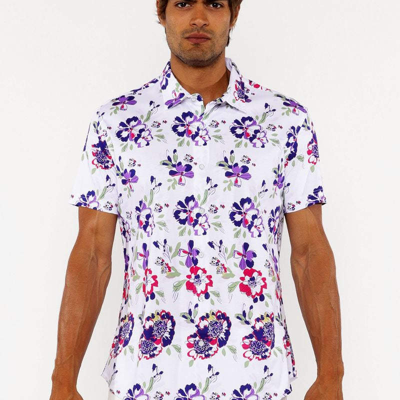 Man wearing a floral short-sleeve shirt on a white background